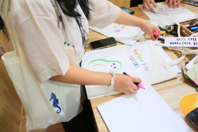a photo of woman making a eco bag with pink highlighter
