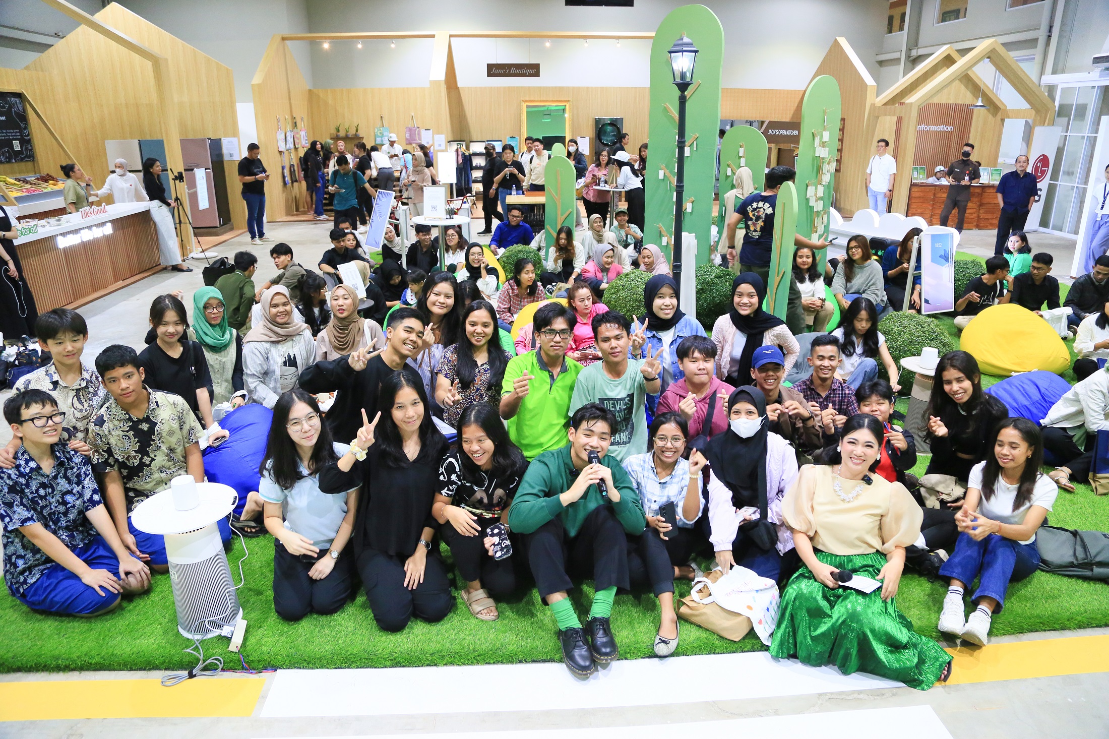 A group photo of people smiling and posing at the Better Life Festival