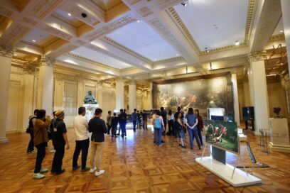 A photo of crowded visitors checking out the LG OLED TVs on display at the gallery