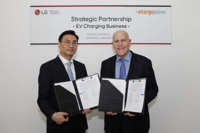 A picture of LG Electronics (left) and ChargePoint (right) representatives each holding signed MOU documents
