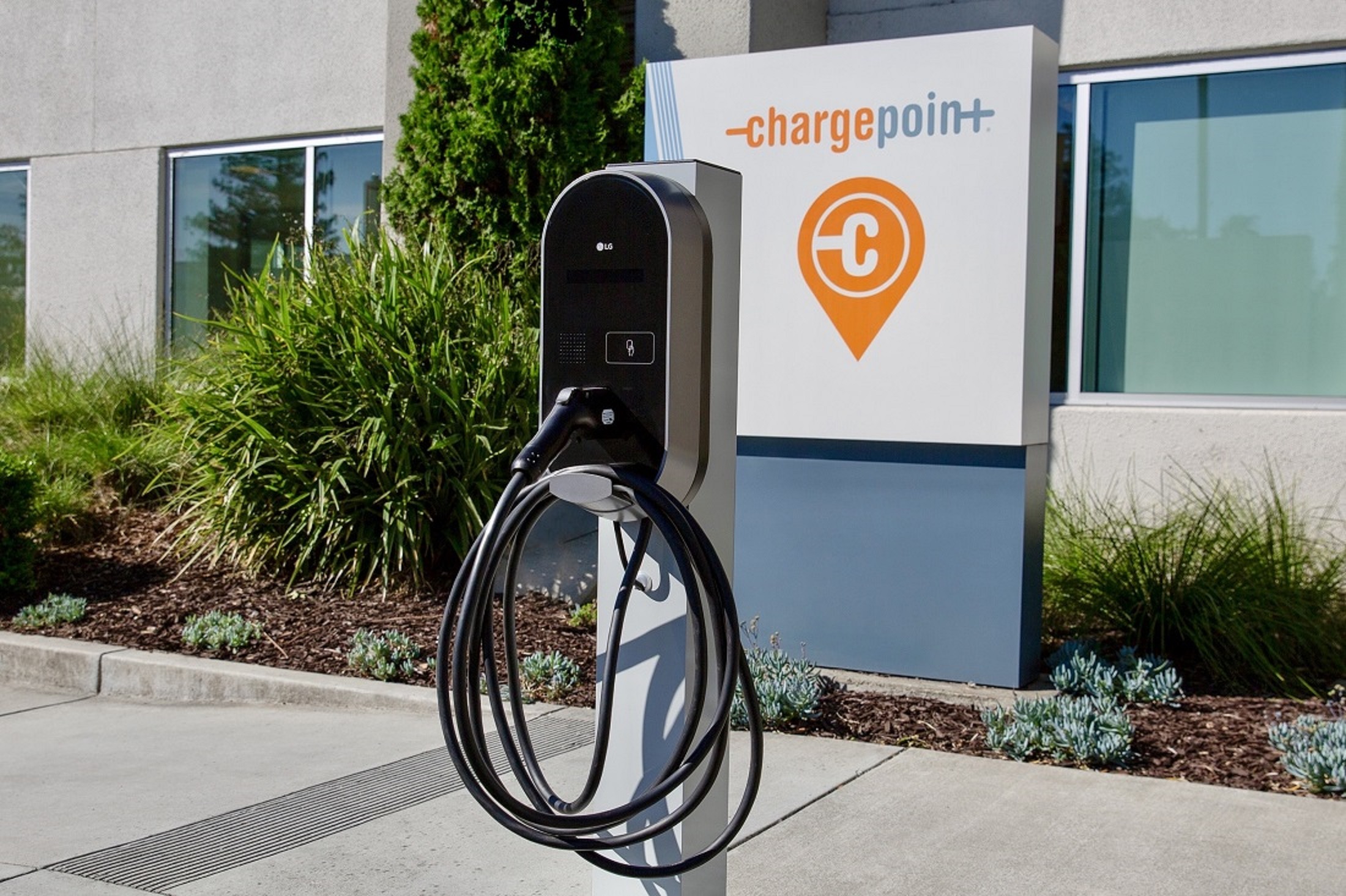 A photo of the right side of the newly combined LG - ChargePoint EV charger with the official ChargePoint logo at the back