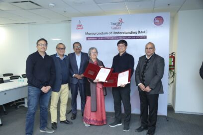 A picture of six people standing for a photo regarding the MOU