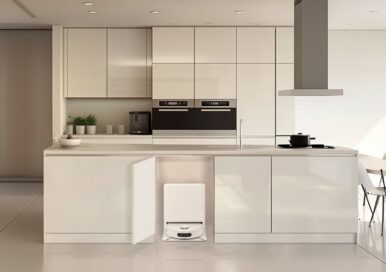 A photo of an 'all-in-one' robot vacuum and mop set up in a kitchen