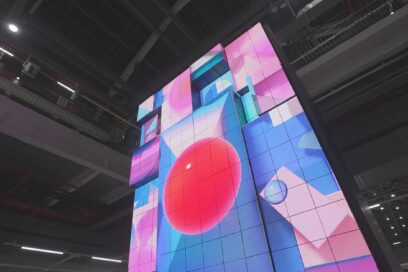 A close-up of the kinetic LED signage displaying artwork
