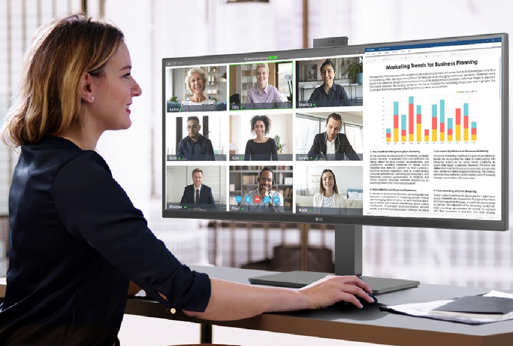 An image of a woman using the LG ergonomic business monitor