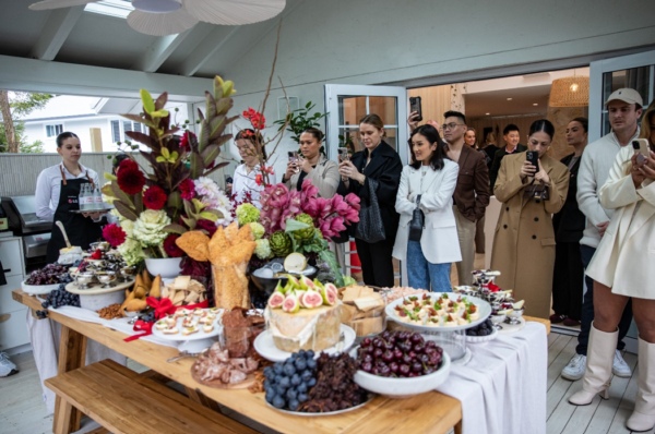 A group of people taking pictures at the event