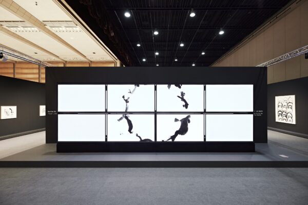 A picture of eight LG OLED screens displaying artwork