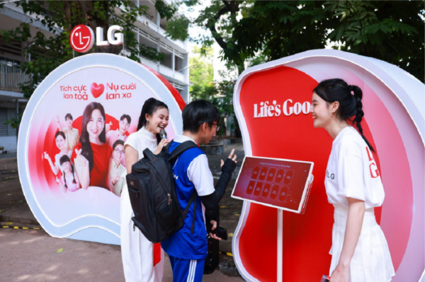 A picture of two women helping out a student participate in an event