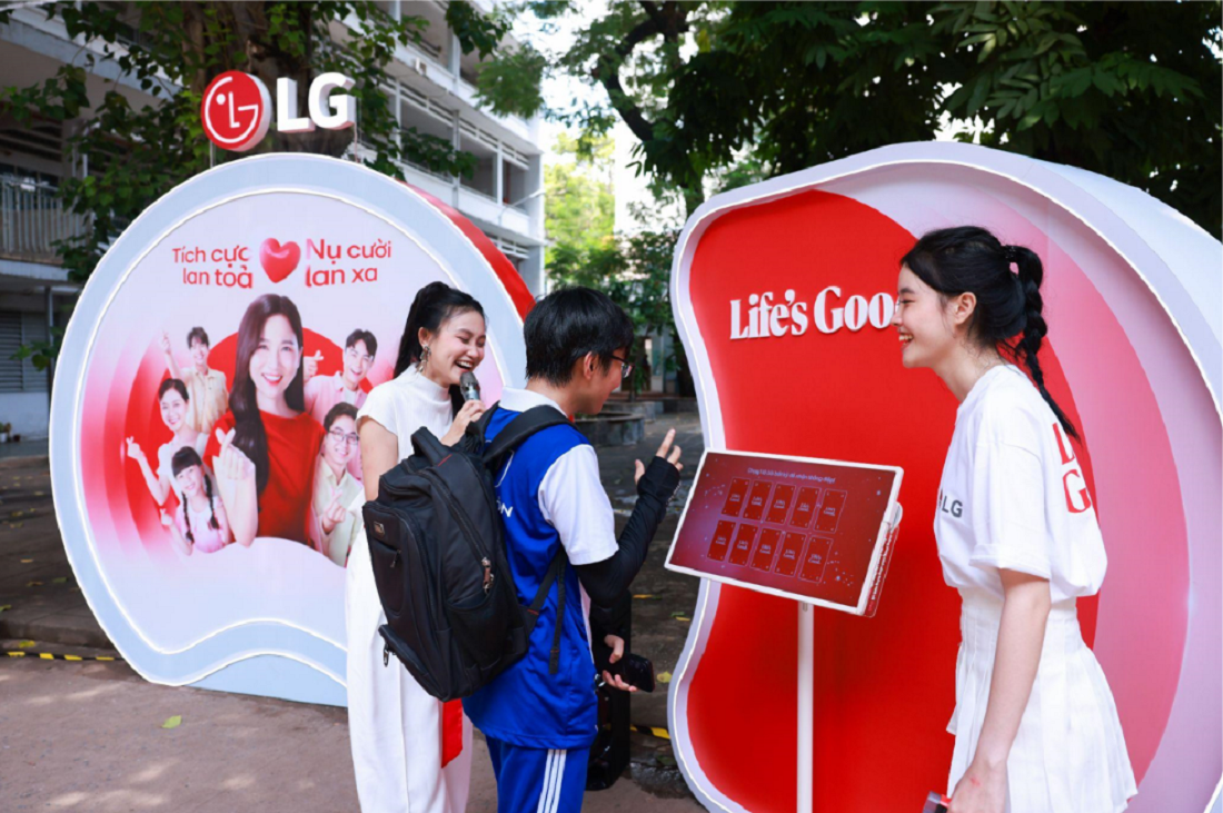 A picture of two women helping out a student participate in an event
