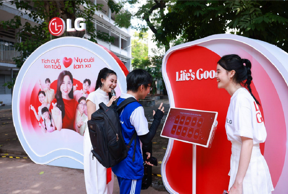 An image of two women helping out a student participate in an event