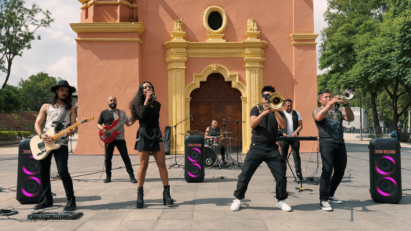 A band from Mexico engages in a lively street performance powered by three LG XBOOM speakers