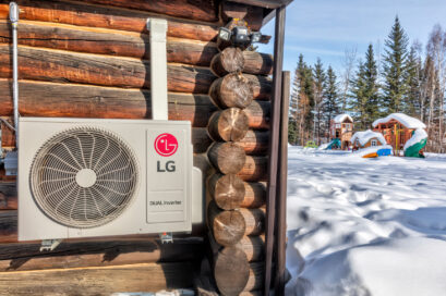 A photo of the LG DUAL Inverter heat pump installed outside a house