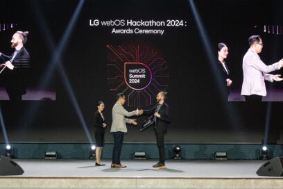 Chris Jo, senior vice president of platform business at LG Home Entertainment Company, presents the second-place award to Lukas Klingsbo