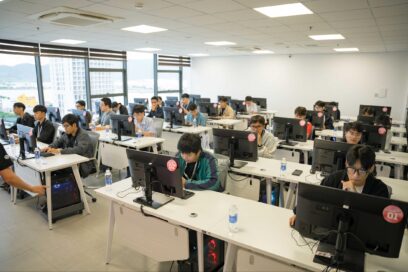 A photo of students sitting in a computer lab as they compete in the final round of The national competition