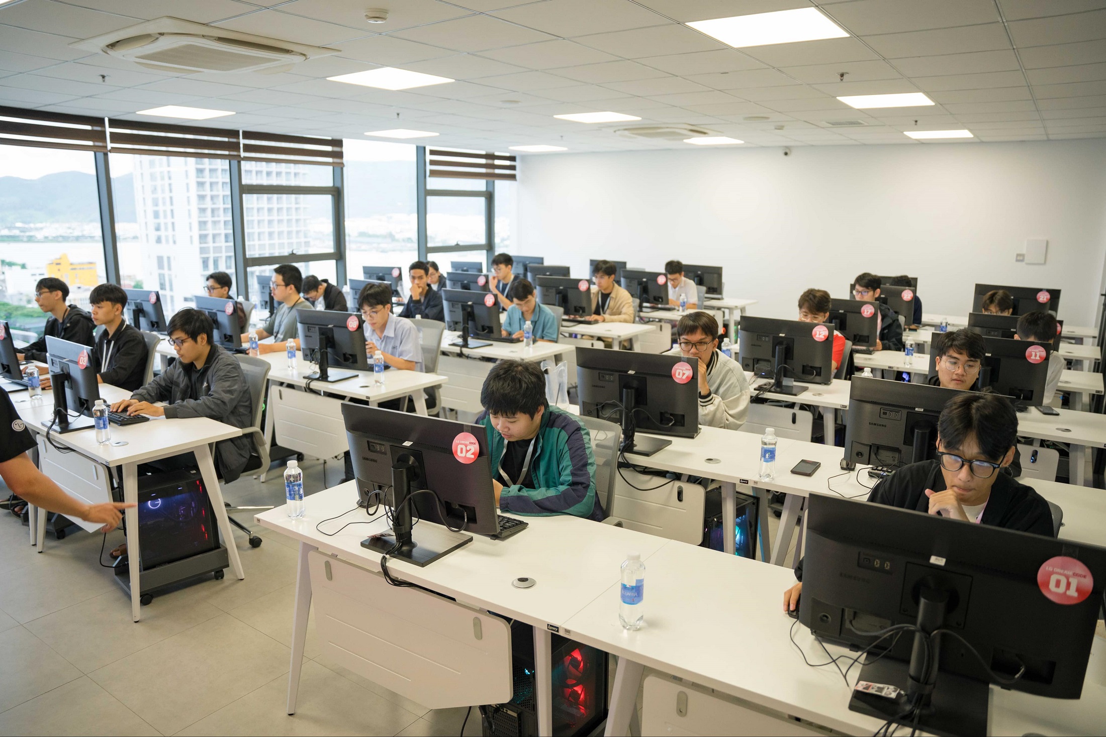 A photo of students sitting in a computer lab as they compete in the final round of The national competition