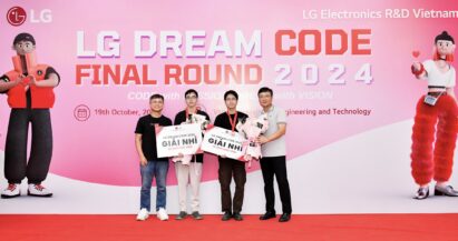 A photo of two winners from the final round of LG Dream Code 2024 and two LG officials smiling with their medals and prizes in front of the photo zone
