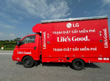 A photo of a red truck with the LG logo and 'Life's Good' on it