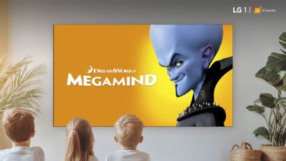 Three children are watching Megamind, which is playing on a wall-mounted LG smart TV