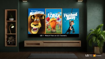 A wall-mounted LG smart TV in a cozy living room displays posters from newly added animated movies on LG 1, including Madagascar, The Lorax and Flushed Away