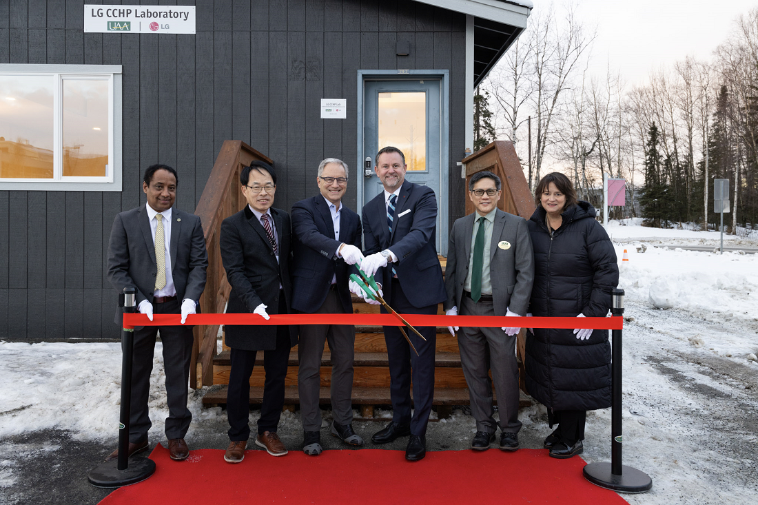 A photo of Professor Getu Hailu (Associate Professor of UAA), Sangok Kweon (Director of LG Electronics research and development), Sean Parnell (UAA Chancellor), Steve Scarbrough (Senior Vice President of LG Electronics USA), Kenrick Mock (Dean of the College of Engineering of UAA), and Suzanne Rigdon (Marketing head of LG Electronics USA) cutting the ribbon
