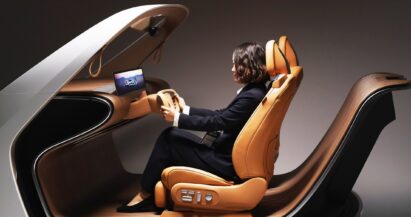 A woman seated in a tan leather seat of LG’s AI-Powered In-Cabin