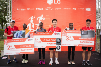 A photo of the 1st, 2nd, and 3rd place winners of the Malaysia Life's Good Run receiving their prizes and medals