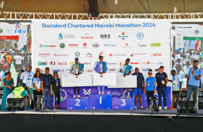 A photo of marathon winners at East Africa receiving their awards on the podium