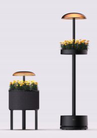 A Photo of the new LG indoor gardening appliances featuring two versions of its modern floor-standing lamp design and a nature-inspired side table design