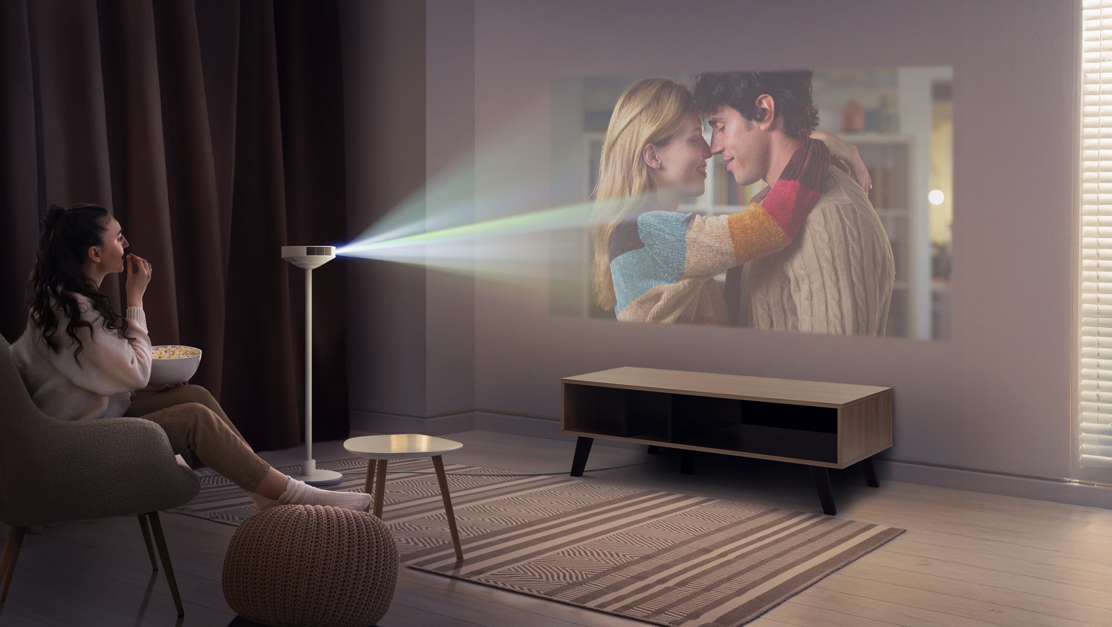 A use case of enjoying a movie with the LG PF600U projector in the living room