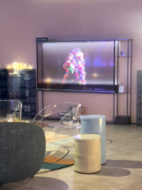 A picture of Kartell products and the LG Signature OLED T displaying artwork