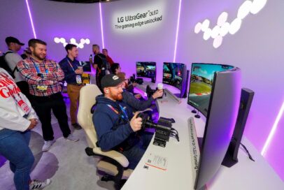 A photo of people excitedly experiencing the monitor at the Gear up & Game (Gaming Playground) zone
